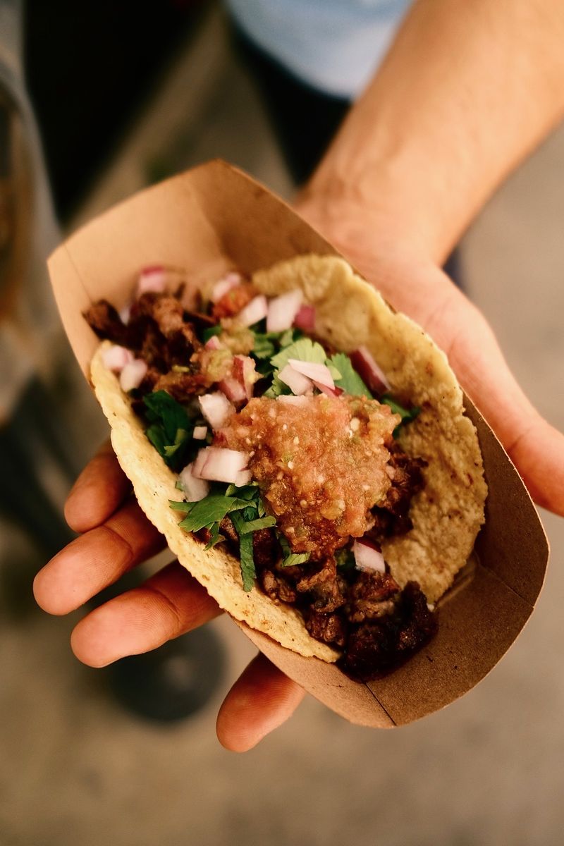 Tacos El Gringo taco held in hand